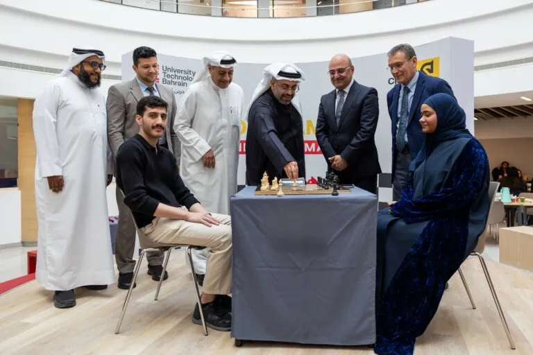 Students and faculty at a UTB Chess Club event in the atrium.